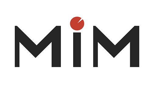 The Music in Minutes small log showing the Letters MiM. The dot on the letter i is a representation of a watch